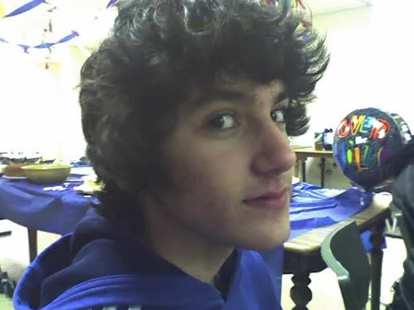 Me in high school, with the dark tousled hair and blue polo from that era